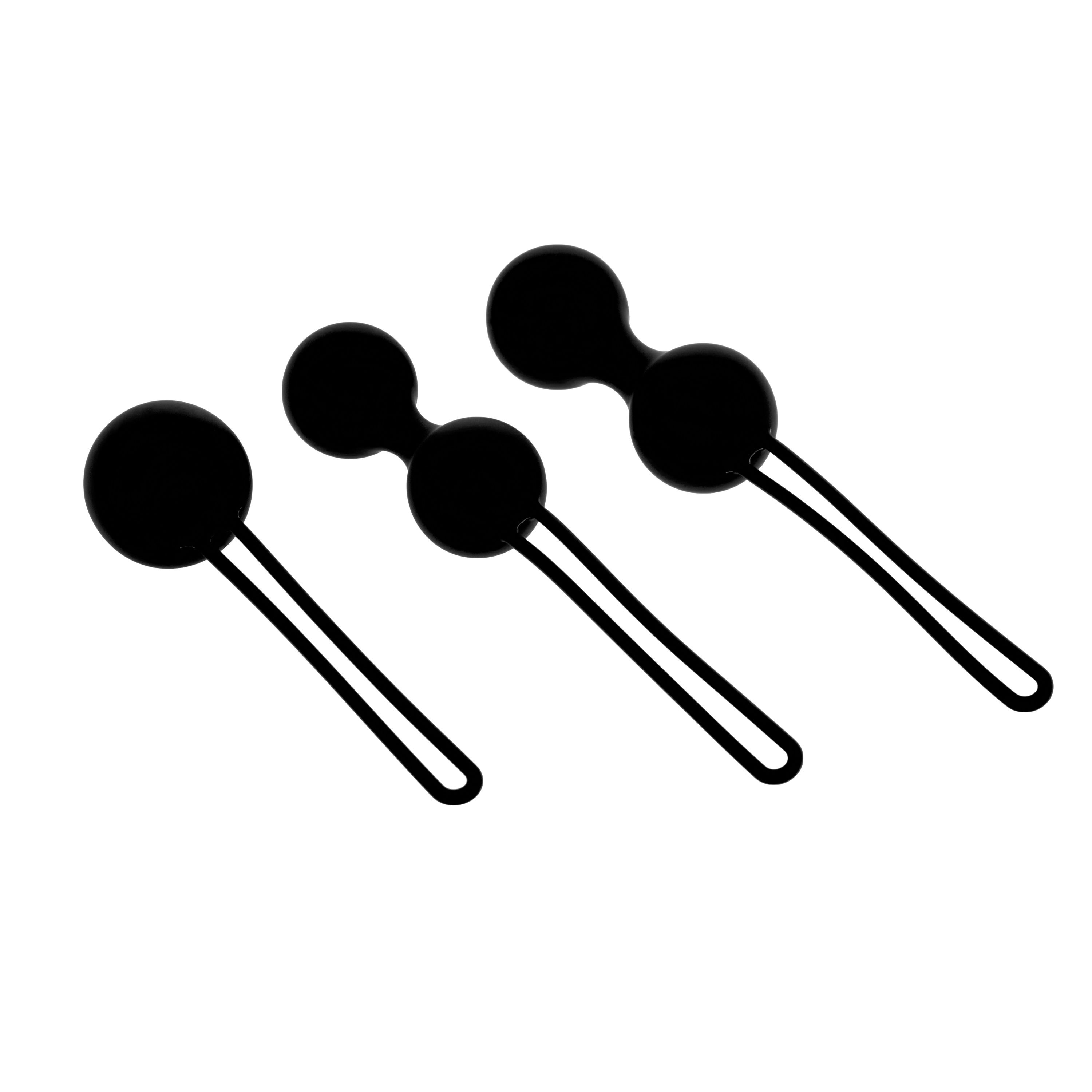 Tre sfere nere con anelli. Due sfere sono collegate. Tutte hanno forma rotonda.