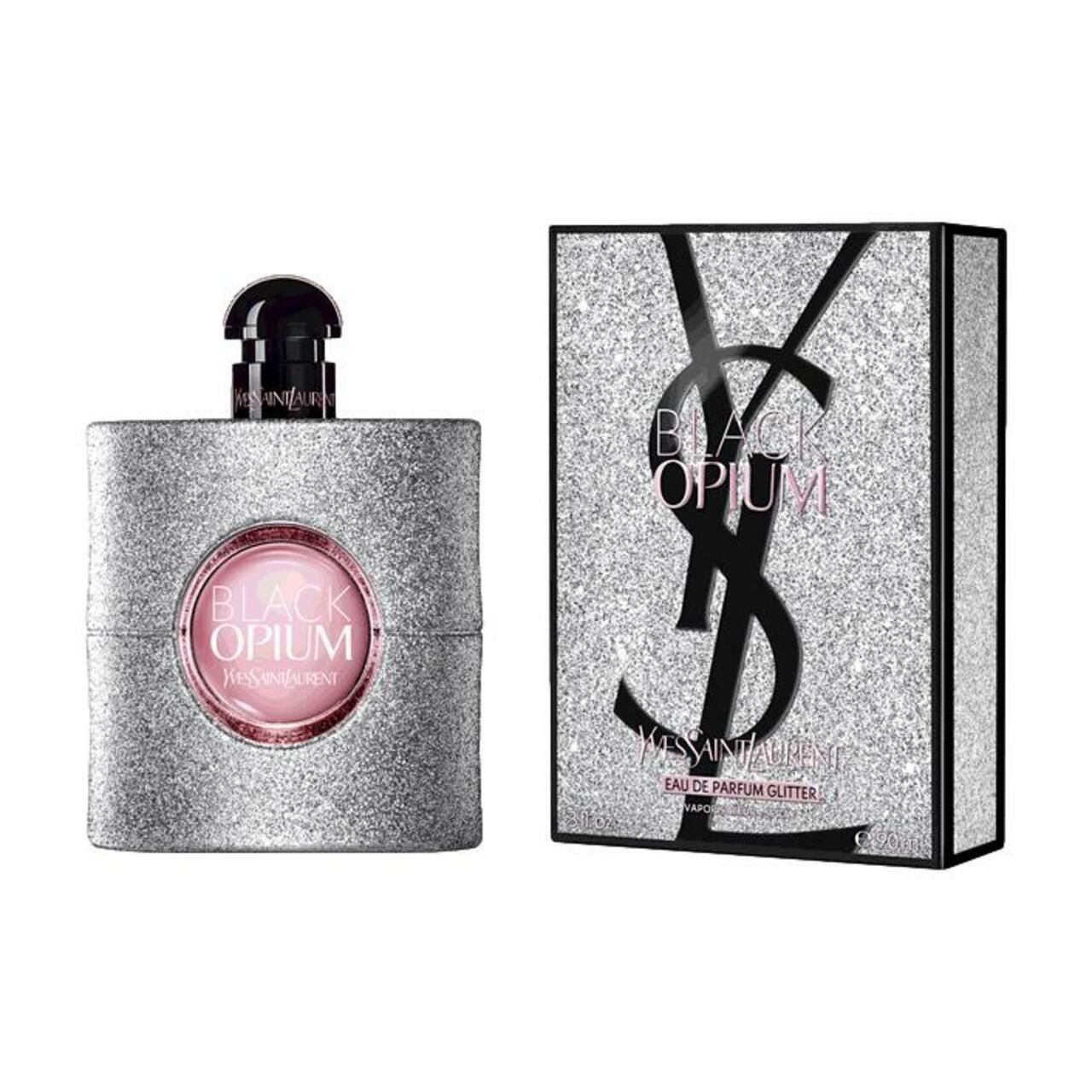 Flacone di profumo e scatola. Flacone con tappo nero ed etichetta rotonda. Scatola con glitter e logo.