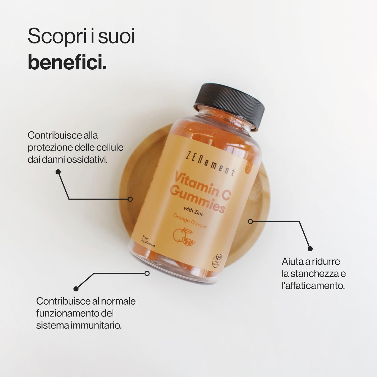 Flacone di caramelle gommose Zenement Vitamina C. Caramelle gommose arancioni. Su sottobicchiere in legno. Testo: Vitamin C Gummies with Zinc, Orange Flavor.