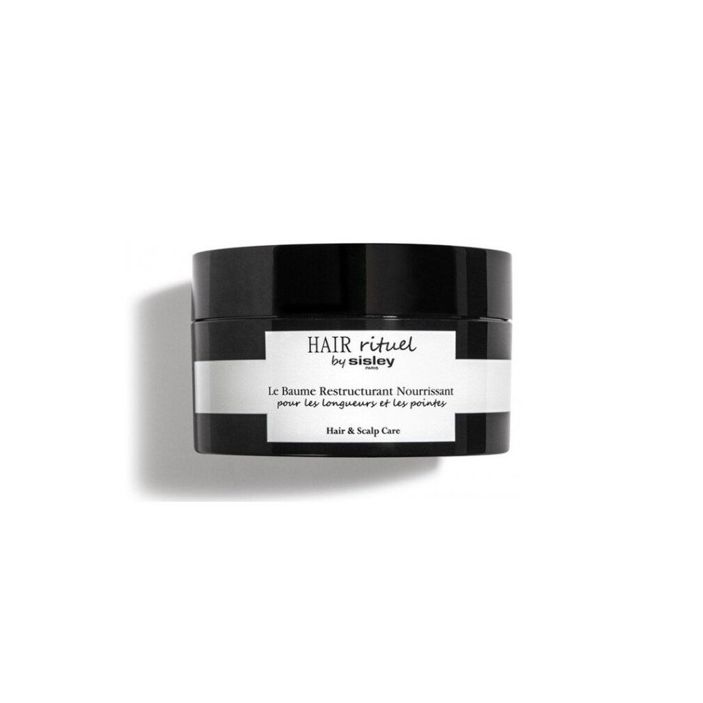 Vaso nero con etichetta bianca. Scritta: HAIR rituel by sisley PARIS. Le Baume Restructurant Nourrissant pour les longueurs et les pointes. Hair & Scalp Care.