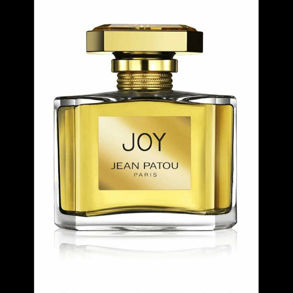 Flacone di profumo con tappo dorato ed etichetta "JOY JEAN PATOU PARIS". Flacone quadrato con liquido dorato.