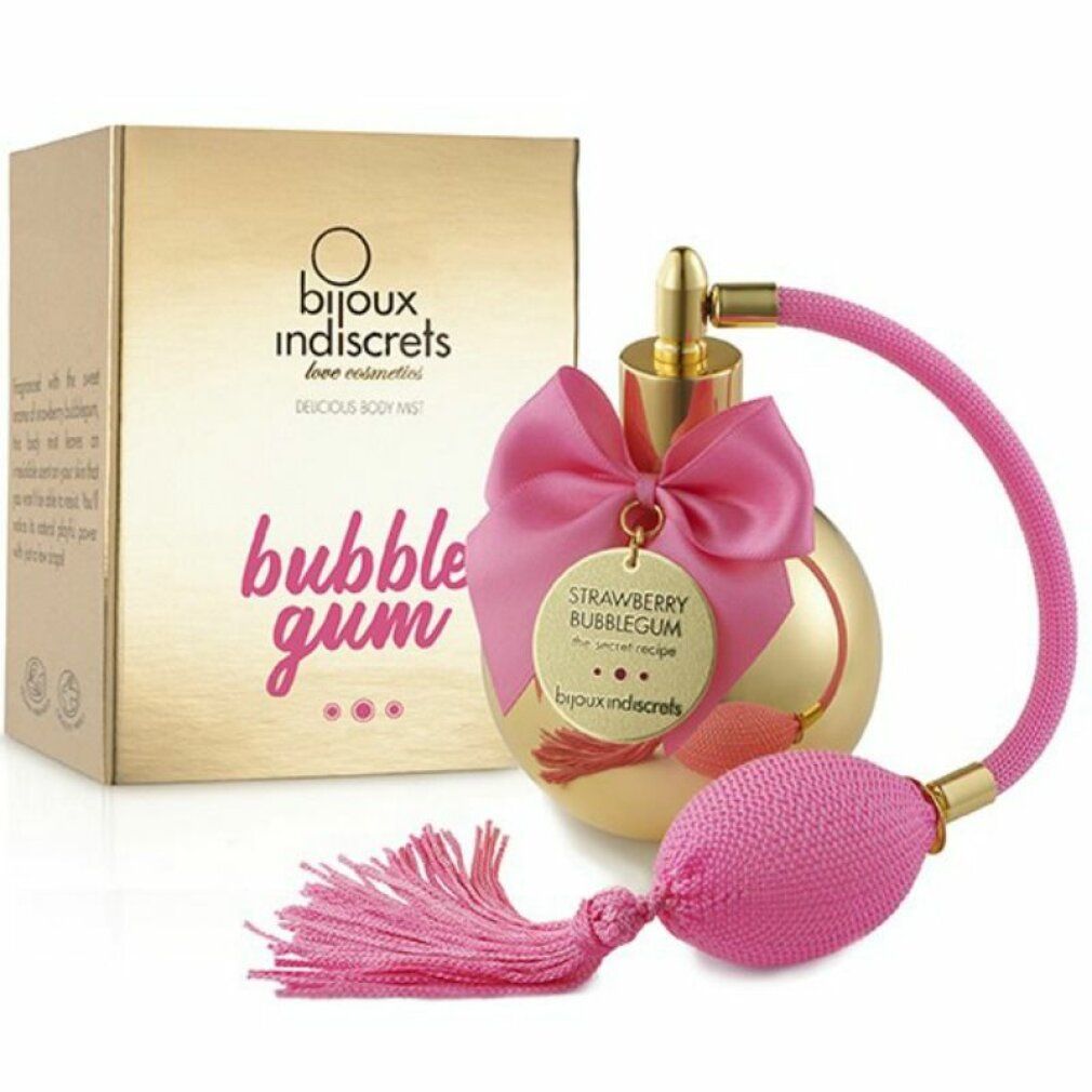 Flacone spray dorato con fiocco rosa e nappa, accanto a una confezione dorata con scritta 'bubble gum'.