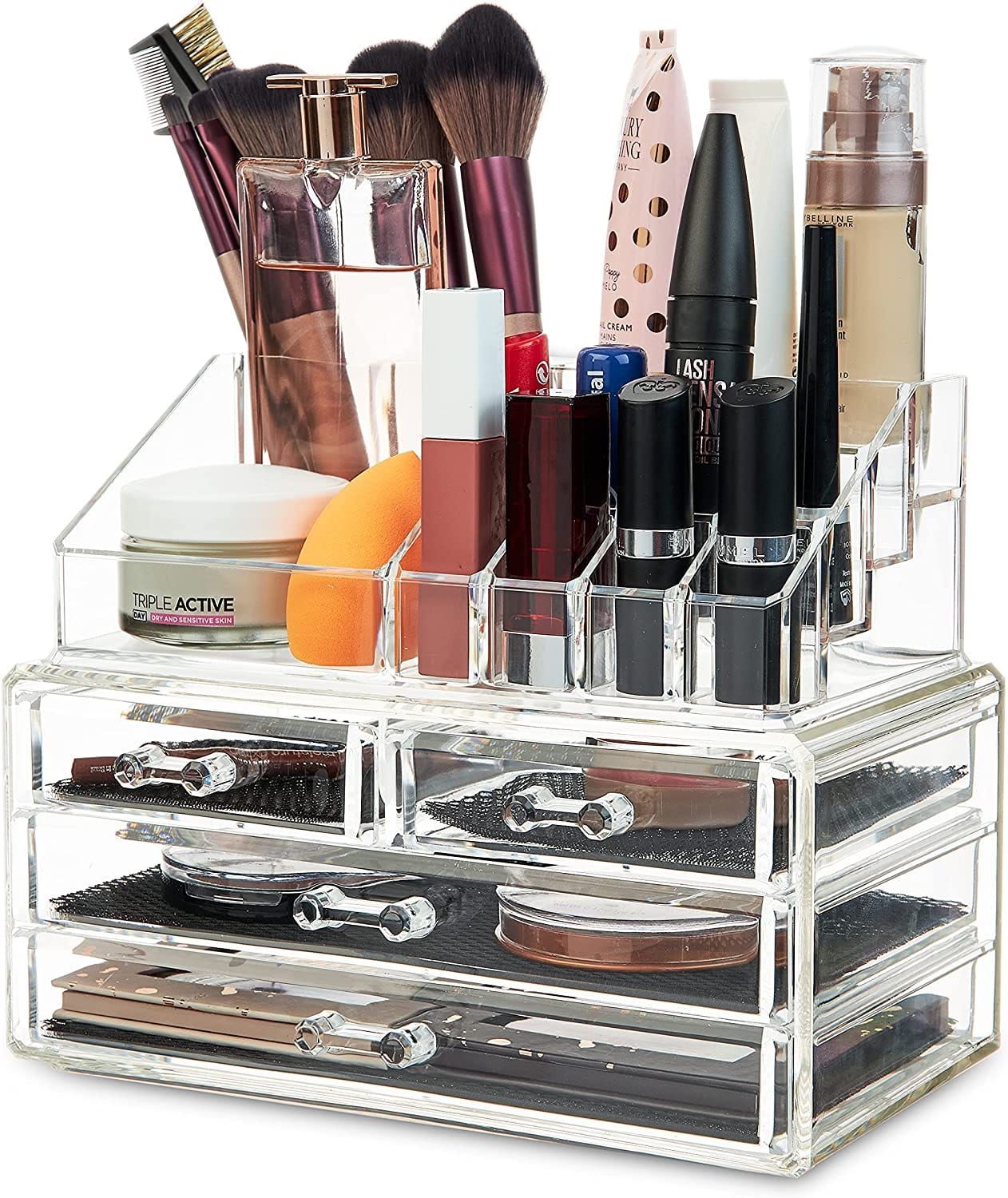 Organizzatore cosmetico trasparente in acrilico con scomparti multipli e cassetti, riempito di trucchi e pennelli.