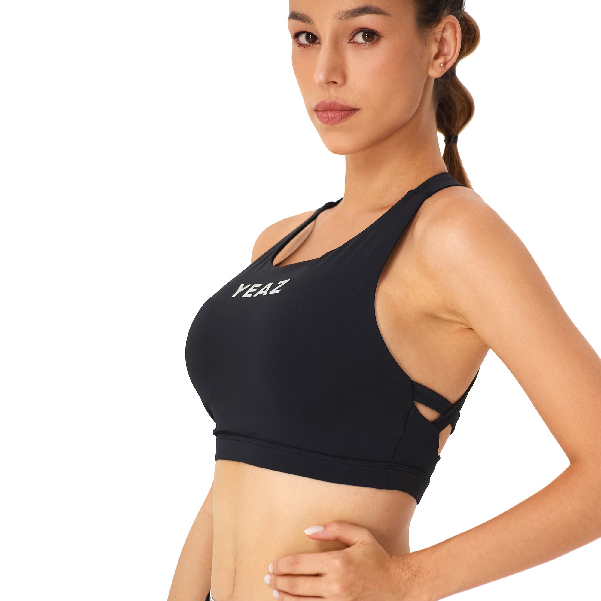 Reggiseno sportivo nero con logo "YEAZ" e spalline incrociate sulla schiena.