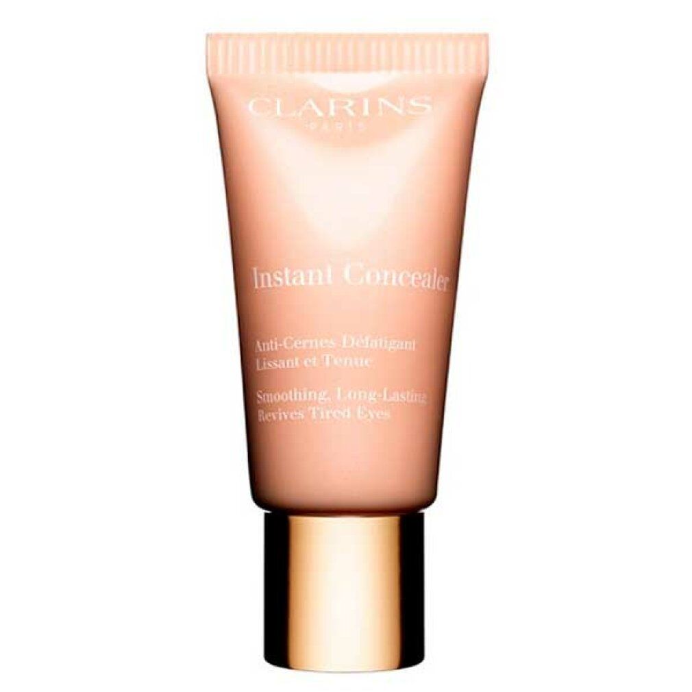 Tubo beige con tappo dorato. Scritta: Clarins, Instant Concealer. Testo: Anti-Cernes Défatigant, Lissant et Teinté, Revives Tired Eyes.