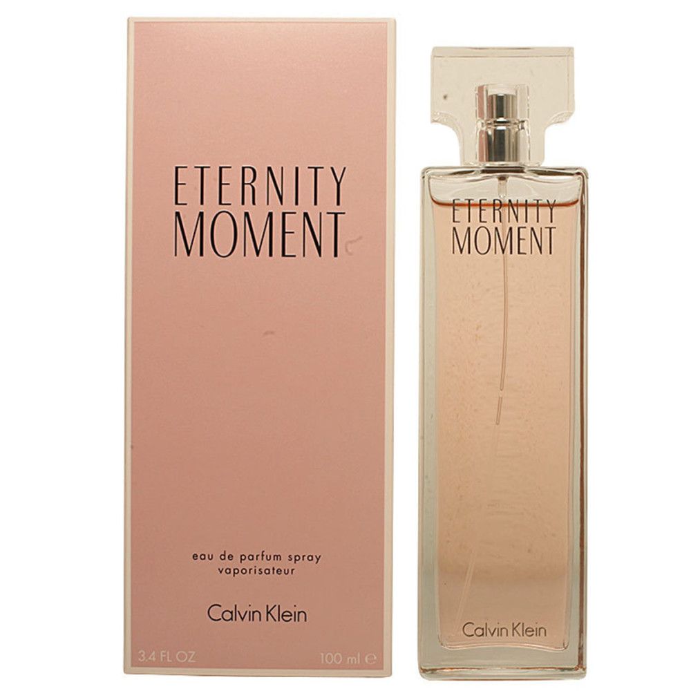 Flacone e confezione rosa. Flacone con scritta "Eternity Moment". Confezione con stessa scritta e "Calvin Klein".