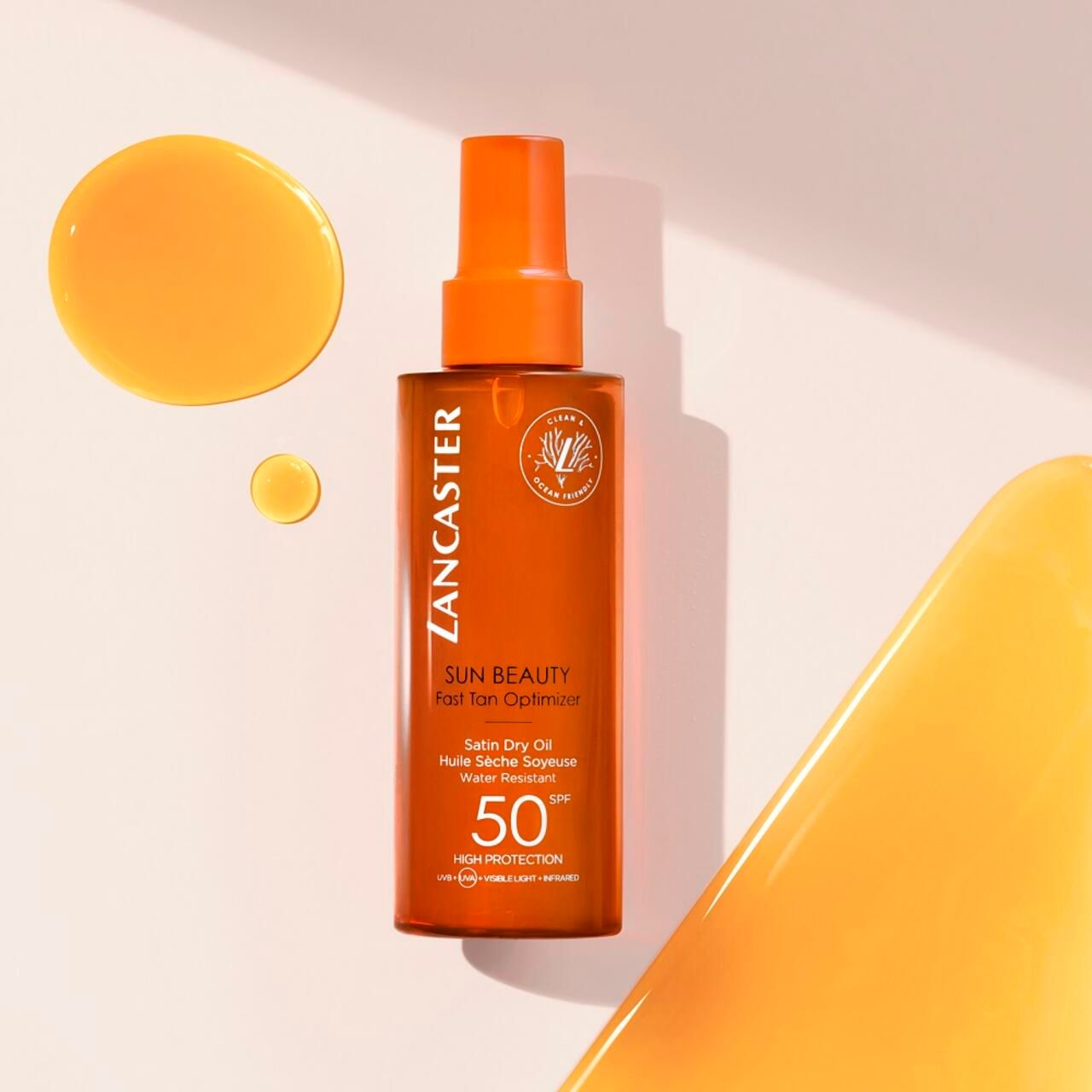 Lancaster Sun Beauty Dry Oil SPF50. Flacone e gocce. Scritta: Sun Beauty, Fast Tan Optimizer, Satin Dry Oil, 50 SPF.