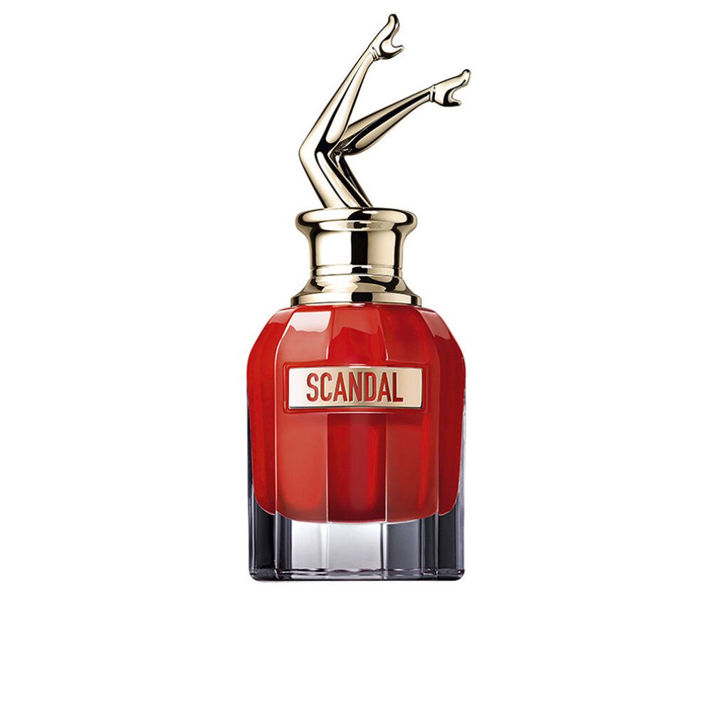 Flacone rosso con tappo dorato a forma di gambe. Scritta "SCANDAL" sul flacone.