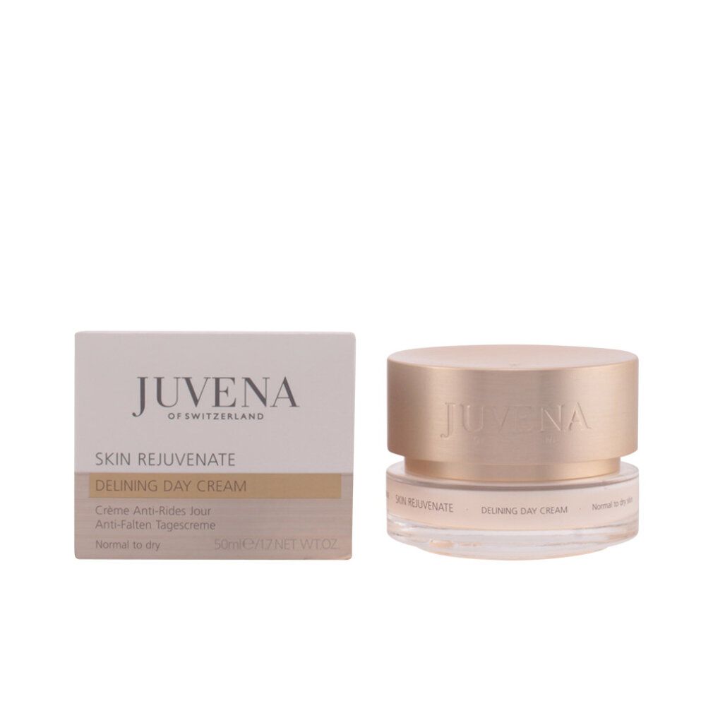 Vasetto di crema e confezione. Sulla confezione è scritto "JUVENA OF SWITZERLAND". Il vasetto ha un coperchio dorato. Scritta: "SKIN REJUVENATE".