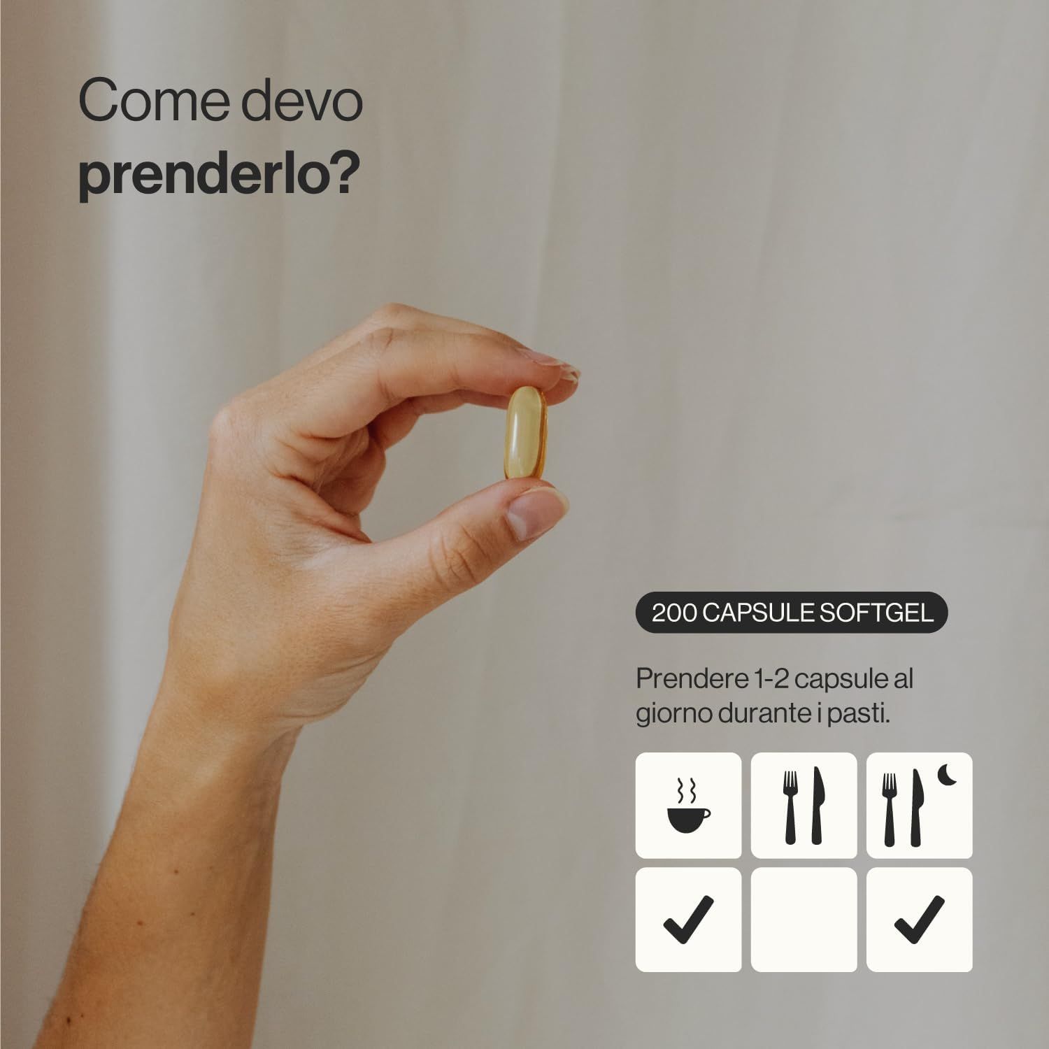 Mano che tiene una capsula gialla. Testo: 200 capsule. Assunzione: 1-2 capsule al giorno durante i pasti. Simboli: caffè, forchetta e coltello, forchetta e coltello con luna.