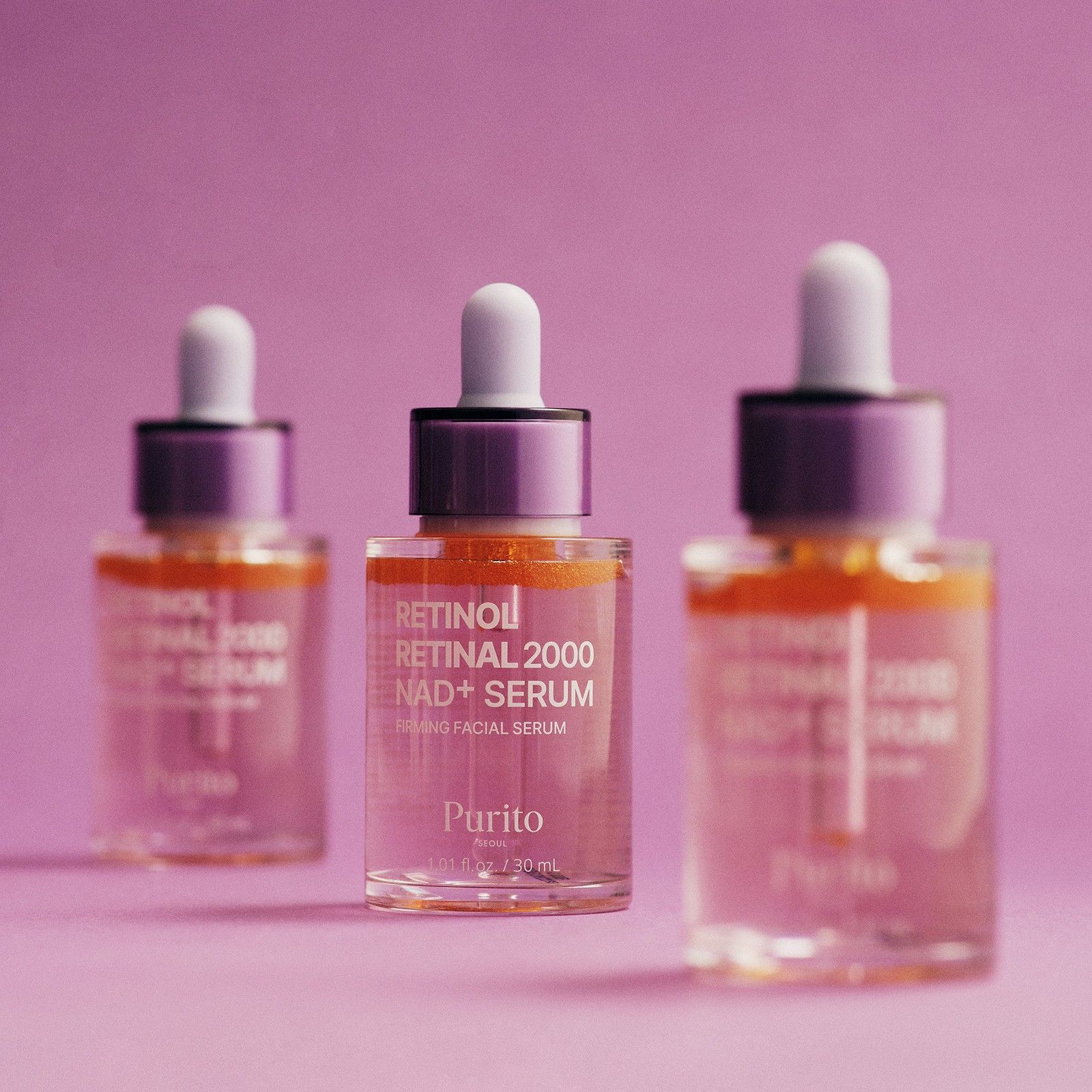 Tre sieri Purito Retinol Retinal 2000 NAD+ in flaconi di vetro con contagocce.
