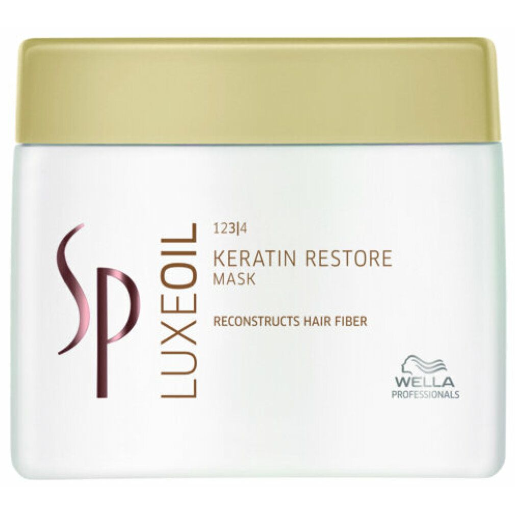 Vaso bianco con coperchio dorato. Scritta: SP Luxeoil Keratin Restore Mask. Logo Wella Professionals.