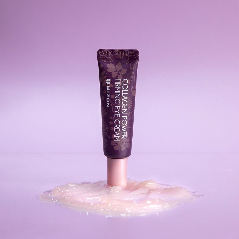 Tubo viola MIZON Collagen Power Firming Eye Cream. Tappo rosa. Testo: Collagen Power Firming Eye Cream. Prodotto su crema.