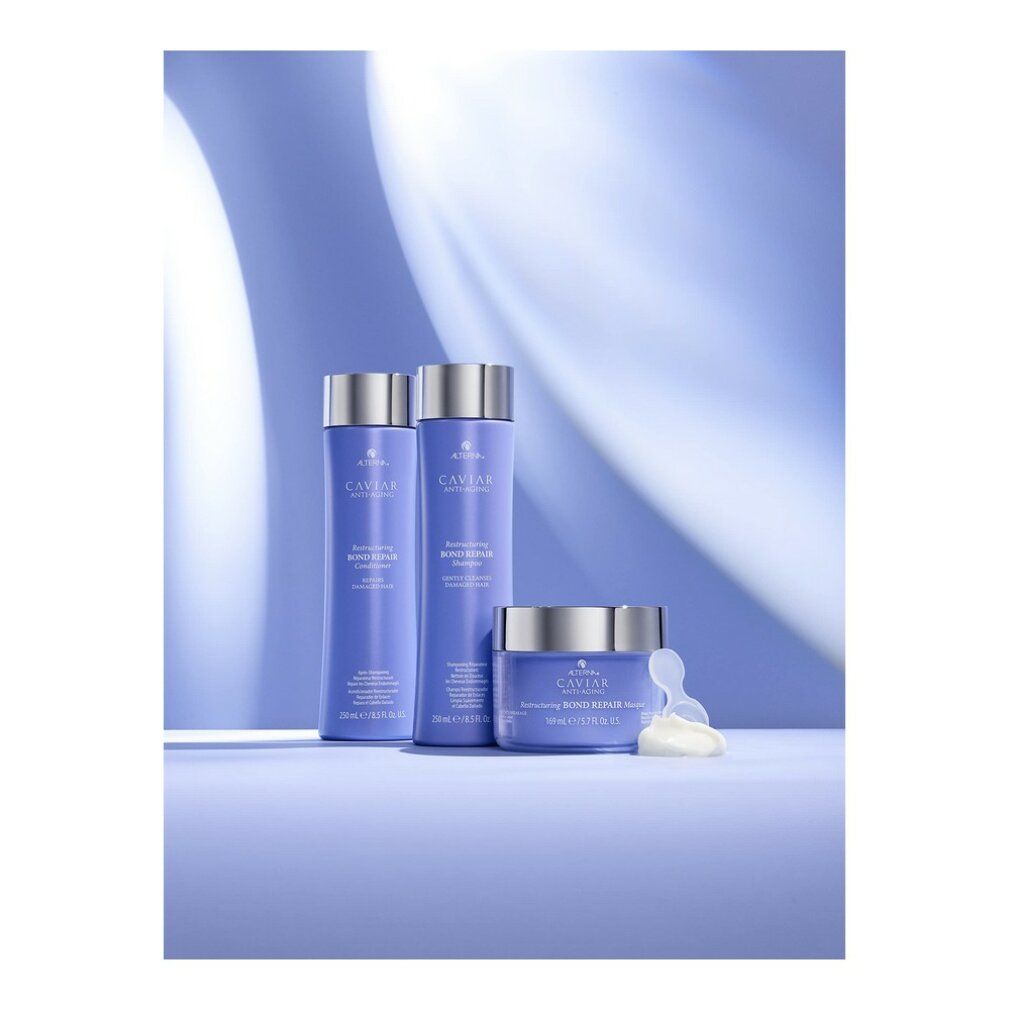 Tre prodotti: flaconi e vasetto. Confezione viola, tappi argento. Scritta: Alterna Caviar Anti-Aging, Restructuring Bond Repair.