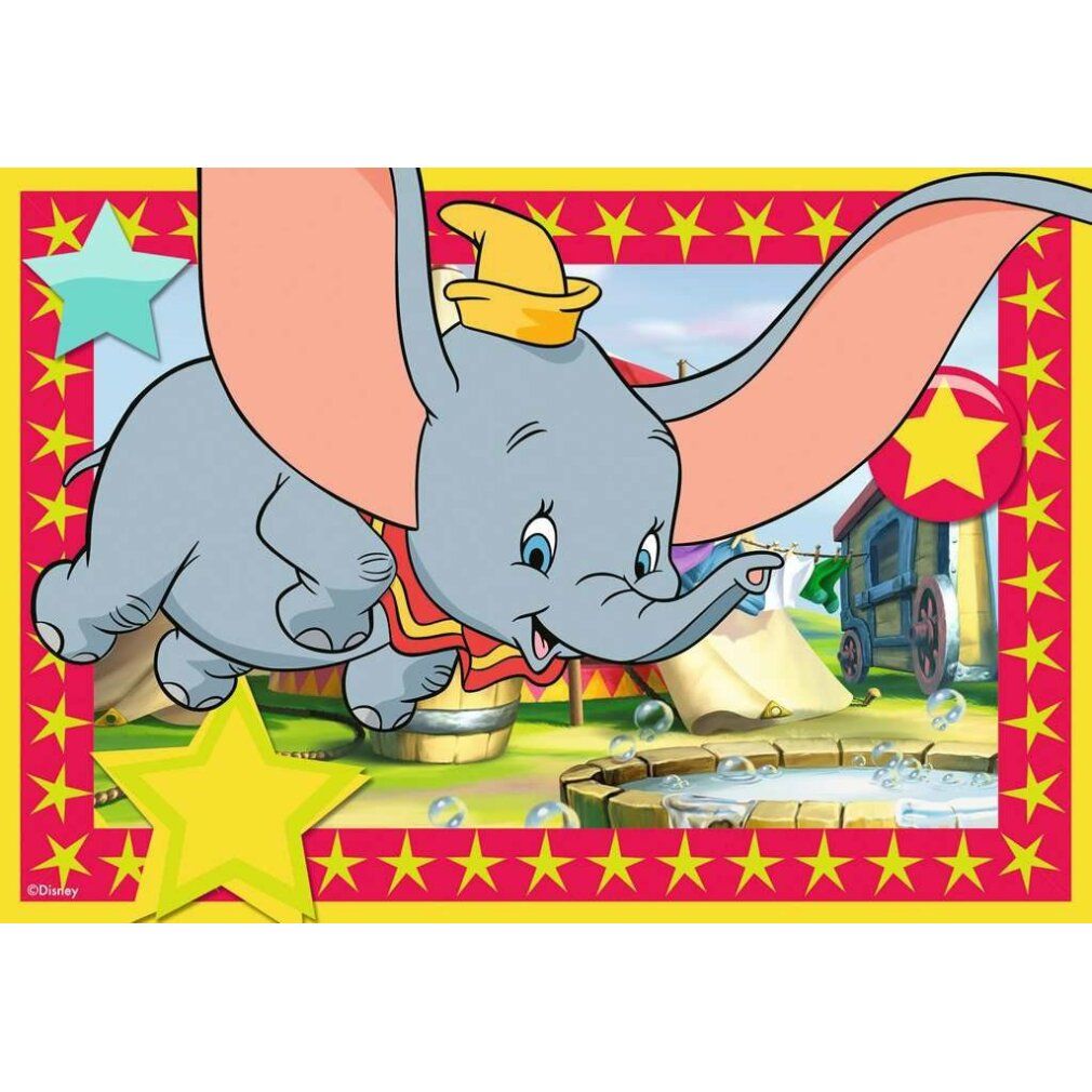 Puzzle: Dumbo che vola, cornice gialla con stelle. Tenda del circo e bolle di sapone sullo sfondo.