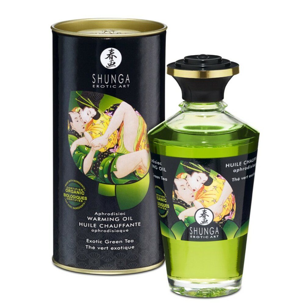 Olio da massaggio Shunga Green Tea, bottiglia e scatola. Olio verde, etichetta con baci.