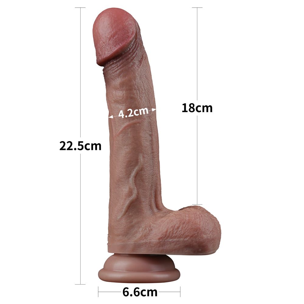 Dildo marrone, consistenza realistica, base. Punta rosa. Dimensioni: 22,5 cm x 18 cm.