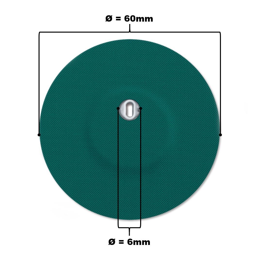 Cerotto rotondo verde con foro di ventilazione. Diametro 60mm. Parte metallica centrale. Superficie tessuta.