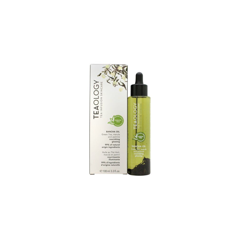 Olio corpo e confezione. Flacone con tappo nero accanto a scatola bianca. Logo e nome del prodotto visibili.