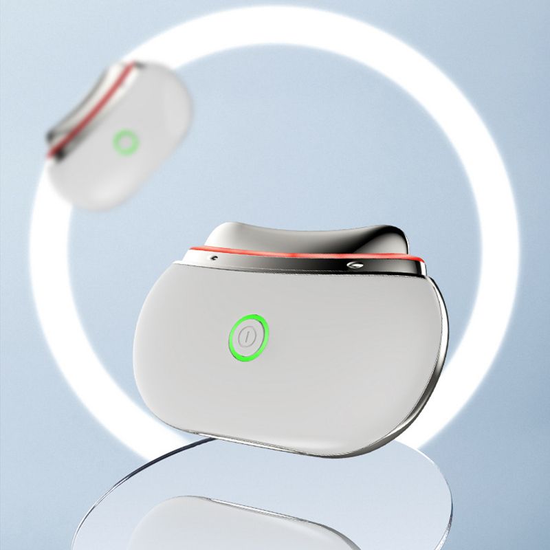 Due dispositivi di sollevamento facciale LED Gua Sha bianchi con bordo argentato e pulsante di accensione verde, su sfondo chiaro.