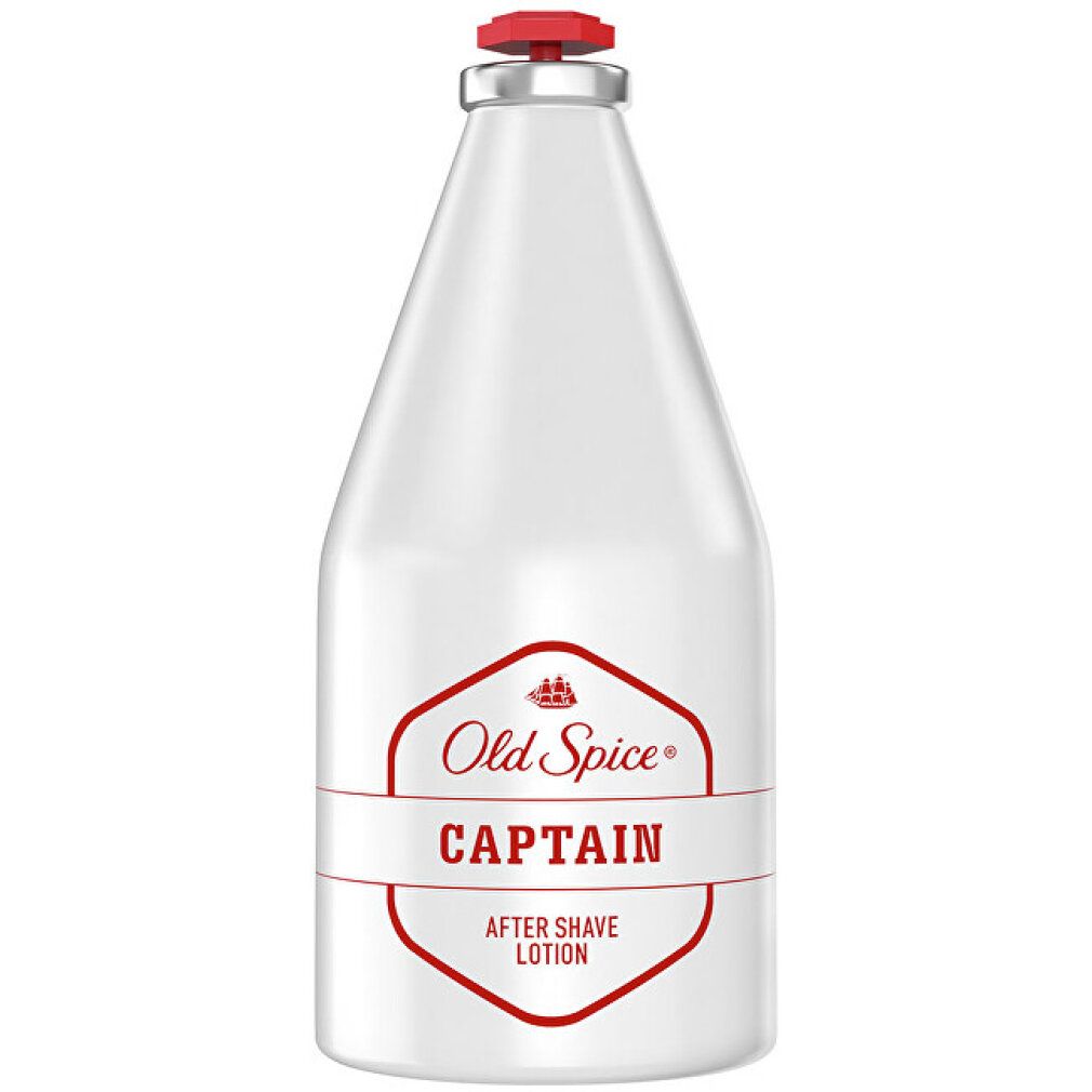 Flacone bianco con tappo rosso. Scritta: Old Spice Captain After Shave Lotion.