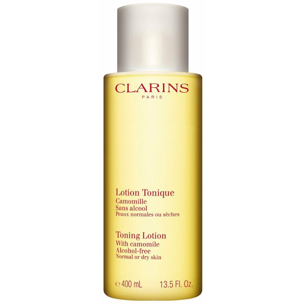 Clarins Lotion Tonique. Liquido giallo in bottiglia con tappo bianco. Testo sull'etichetta. 400 ml.