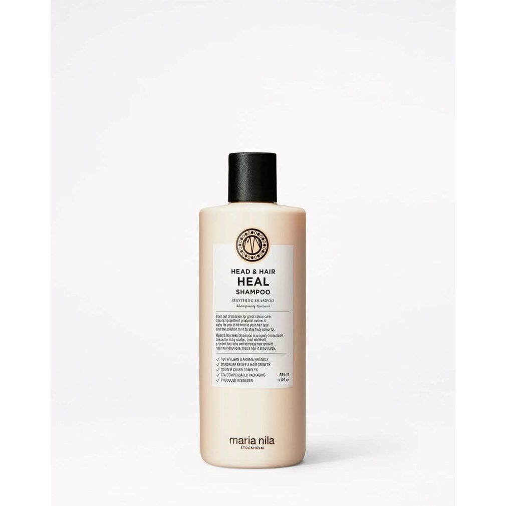 Maria Nila Head & Hair Heal Shampoo. Flacone beige con tappo nero. Etichetta con informazioni e logo. Vegano e cruelty-free.