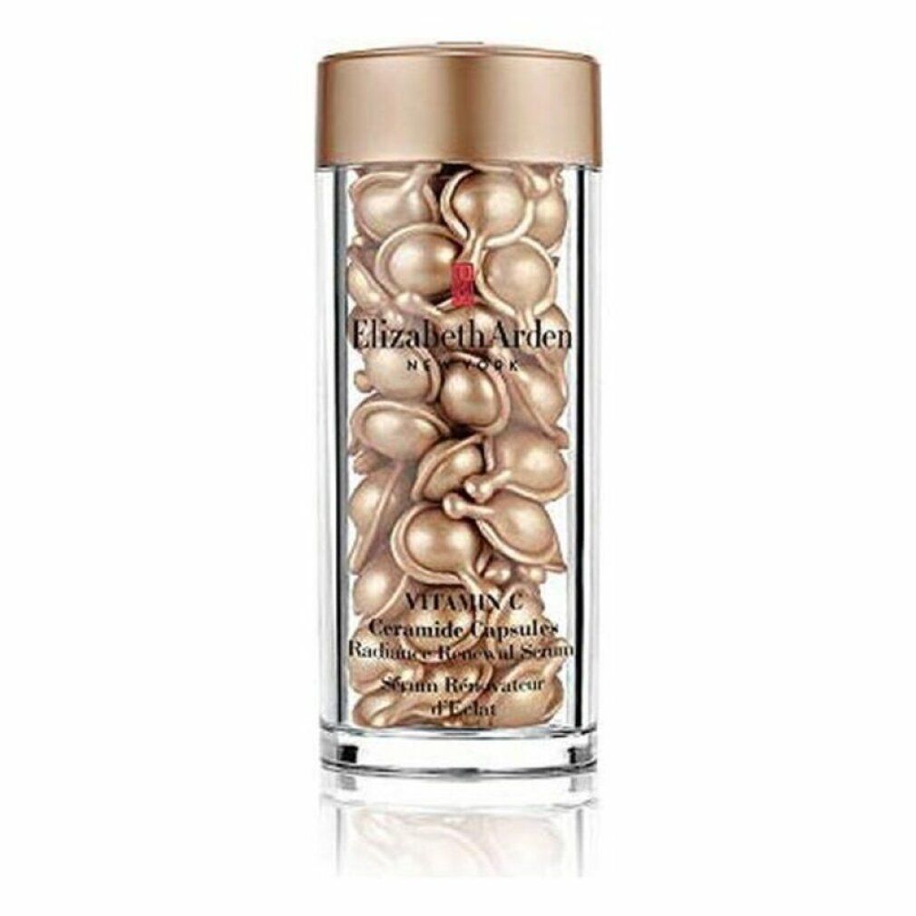 Flacone in vetro con capsule dorate. Scritta: Elizabeth Arden Vitamin C Ceramide Capsules. Siero Rénovateur d'Éclat.