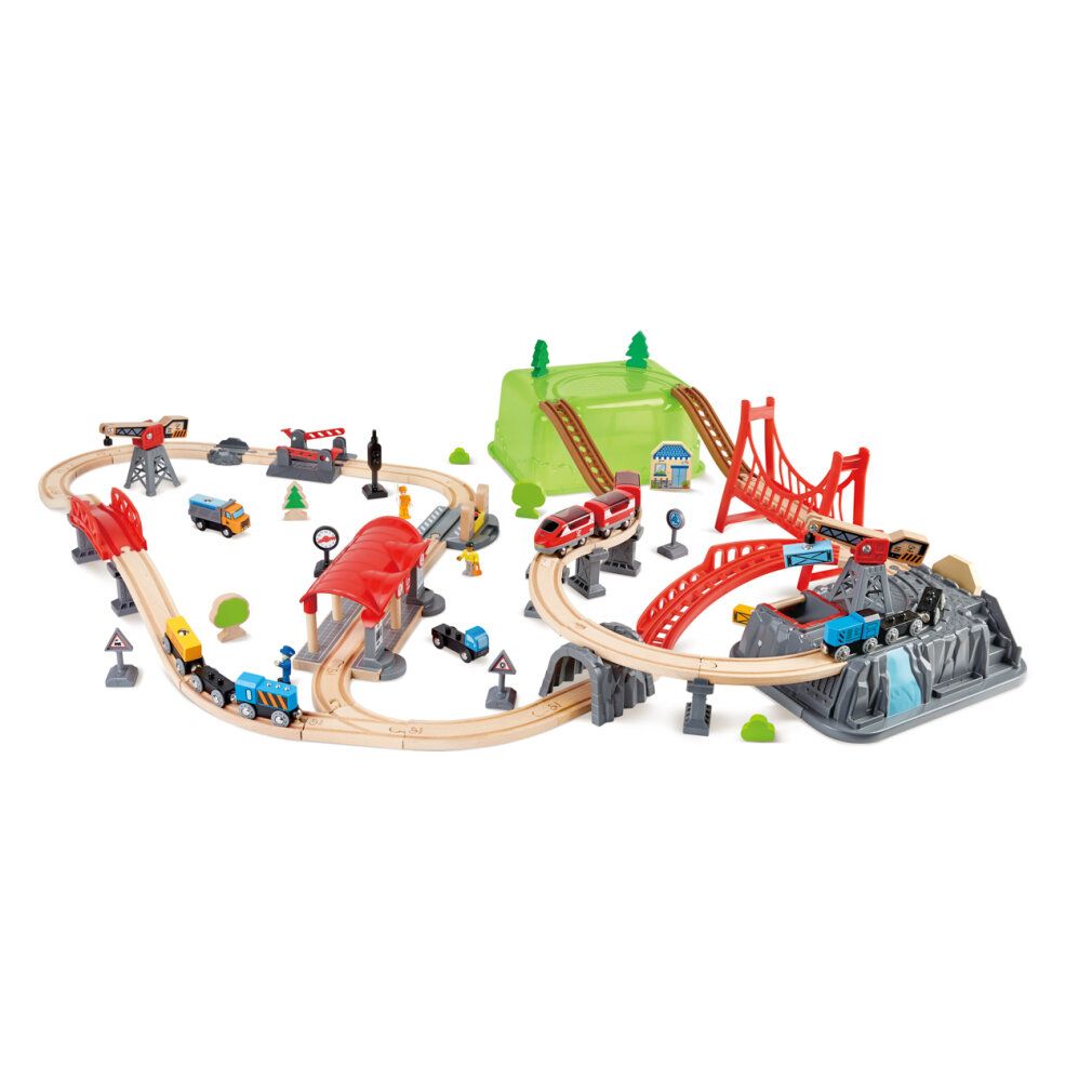 Set di costruzioni ferroviarie con ponti, edifici e treni. Include ponti rossi e marroni, colline verdi e rocce grigie.