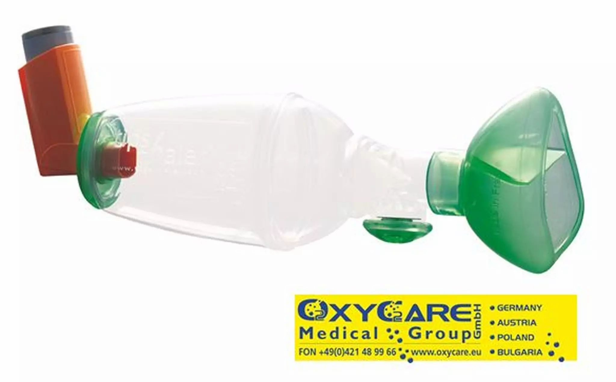Spacer farmaco con inalatore e maschera. Contenitore trasparente con maschera verde e inalatore arancione.