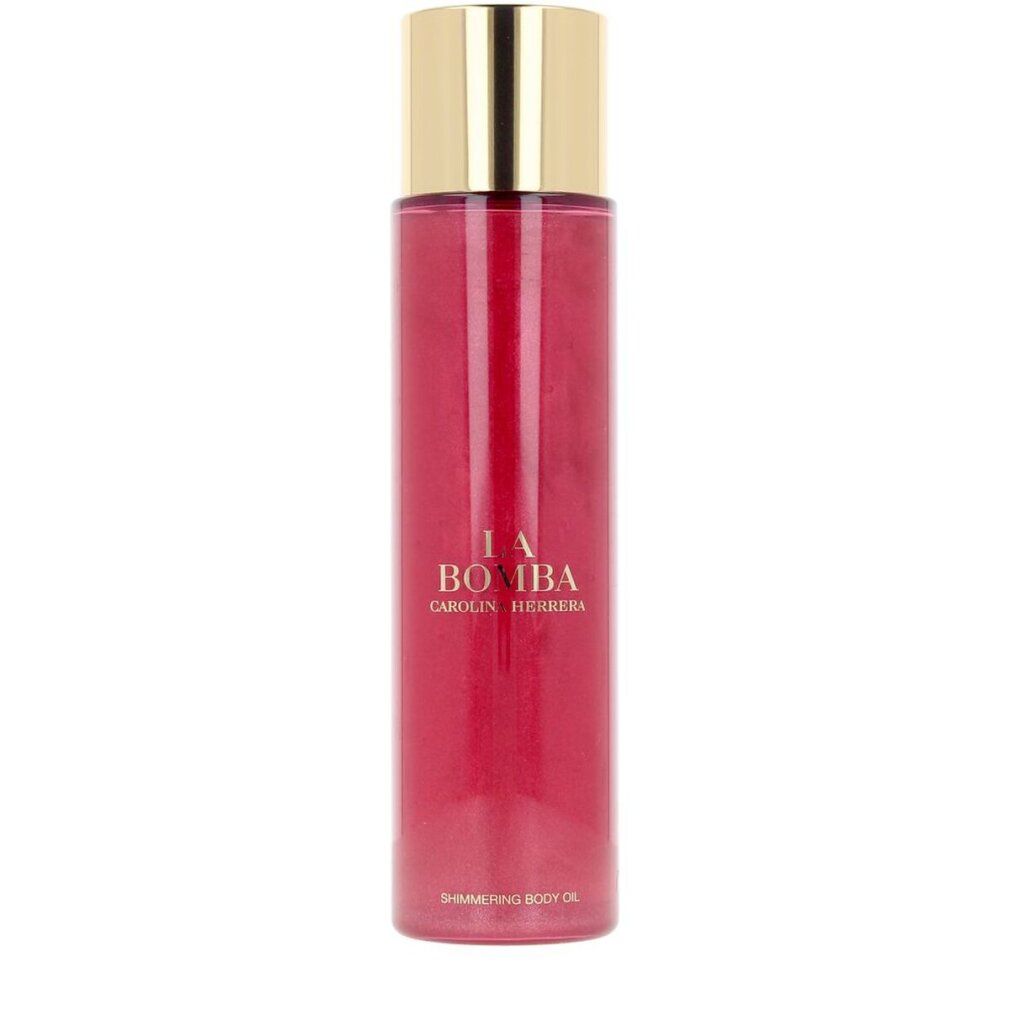 Flacone di olio per il corpo rosa con tappo dorato. Scritta: La Bomba, Carolina Herrera. Shimmering Body Oil.