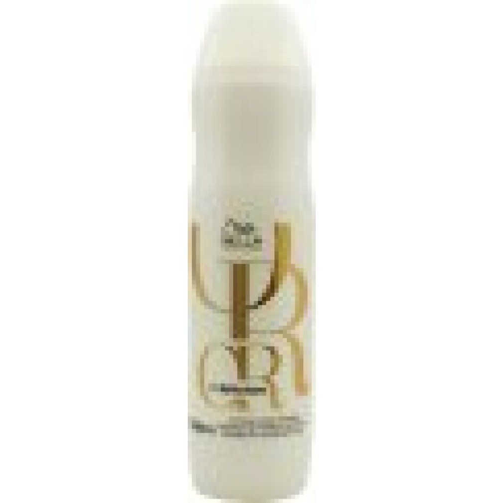 Shampoo bianco con scritta dorata. Logo Wella. Bottiglia dalla forma arrotondata con tappo bianco.