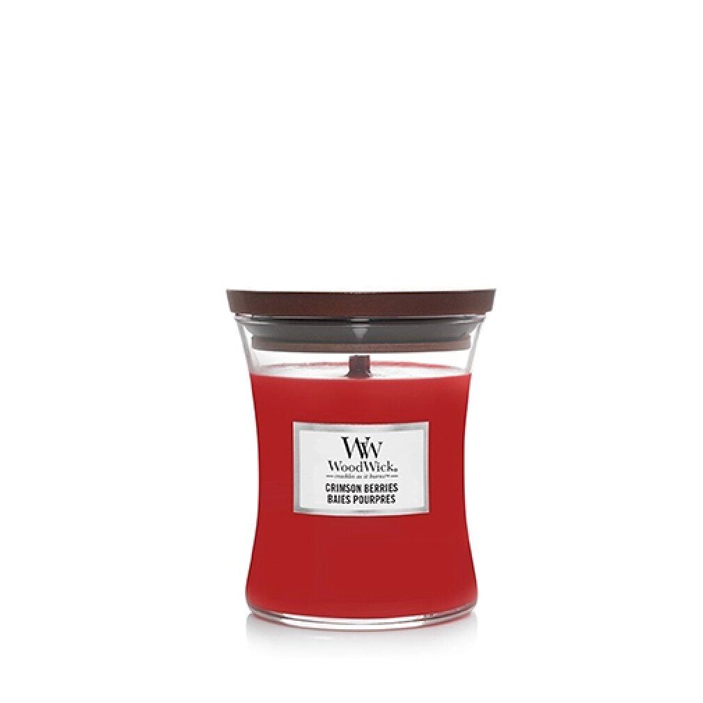 Candela rossa a forma di clessidra con coperchio. Contenitore in vetro con logo WoodWick. Scritta: Crimson Berries.