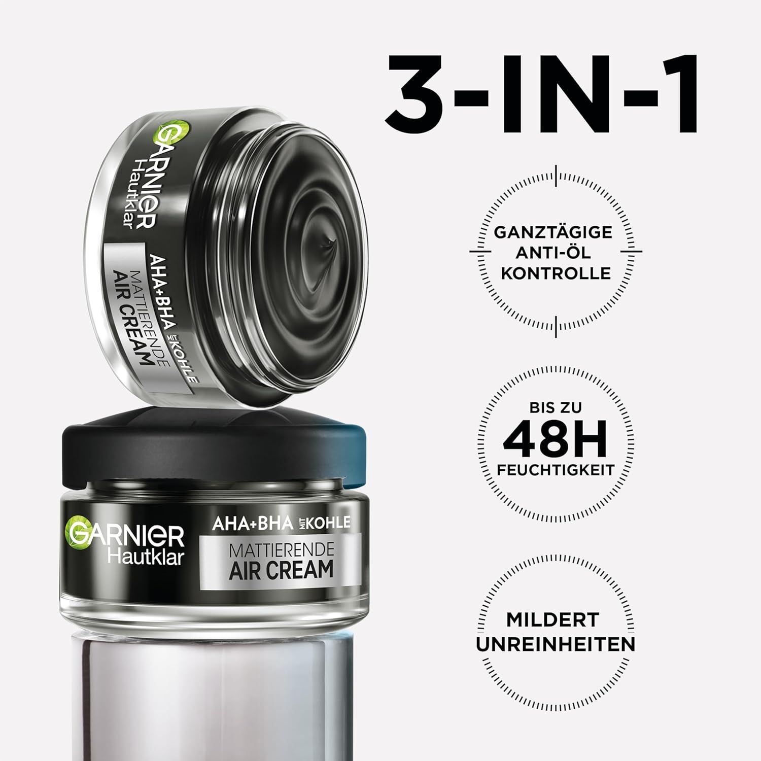 Due vasetti Garnier Hautklar AHA+BHA Kohle Air Cream. Testo: Controllo anti-olio tutto il giorno, fino a 48 ore di idratazione, riduce le imperfezioni.