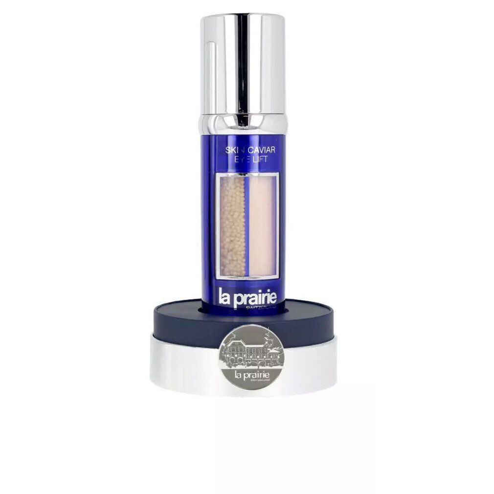 Flacone con etichetta blu, nome del prodotto e perle visibili. Flacone su base. Marchio La Prairie.
