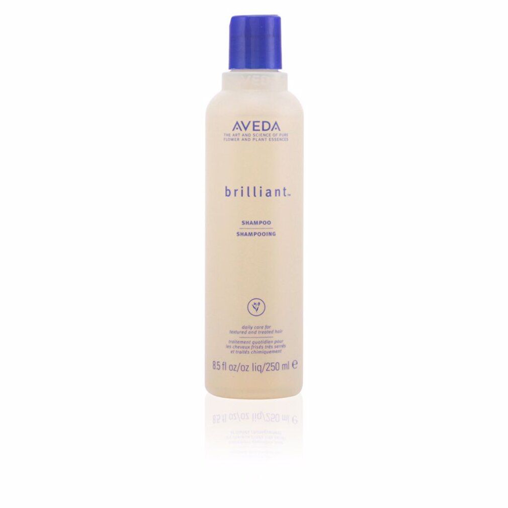 Flacone di shampoo Aveda Brilliant. Flacone beige con tappo blu. Testo: Aveda, brilliant, Shampooing. 250 ml.