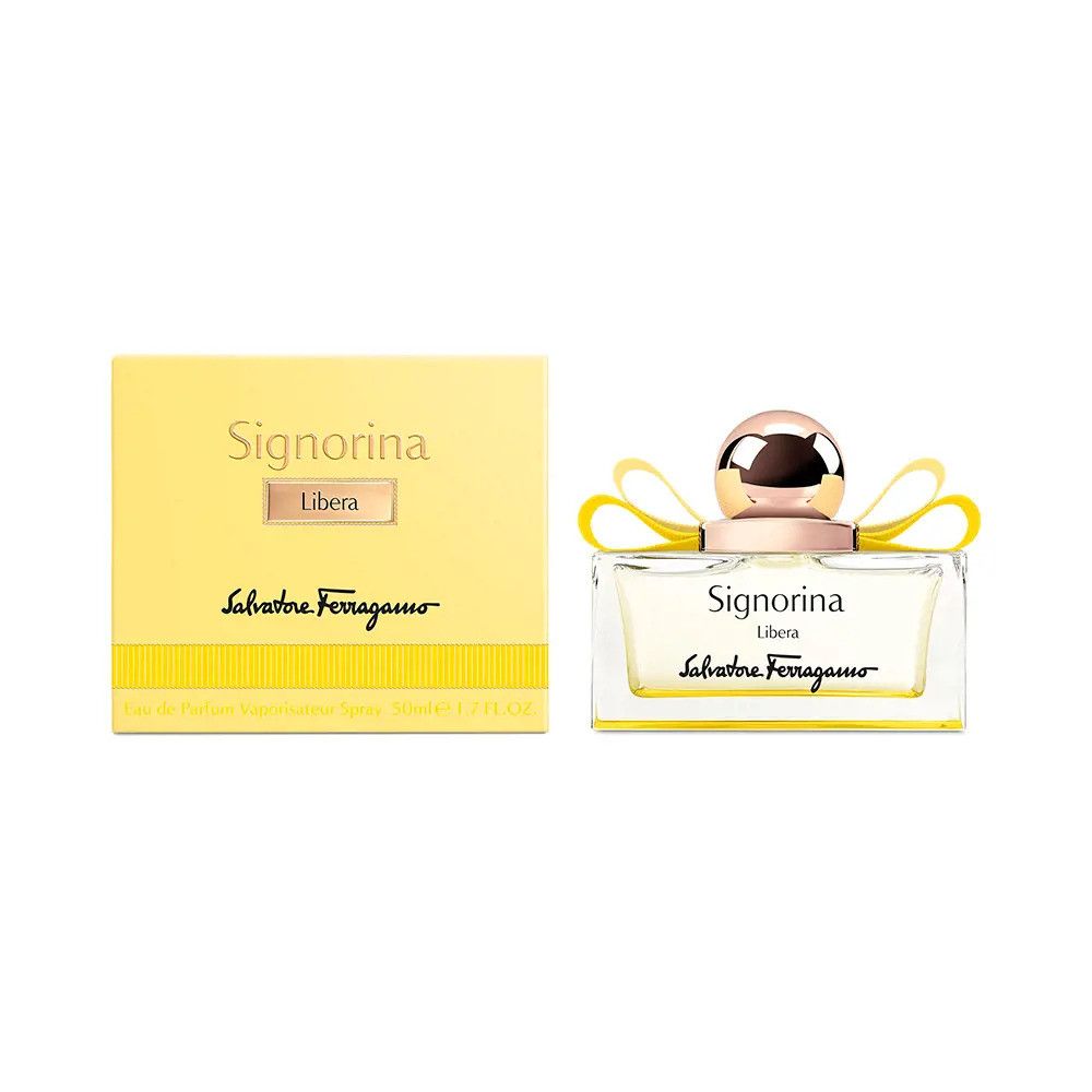 Flacone di profumo e confezione. Flacone rettangolare con liquido giallo, tappo dorato e fiocco giallo. Confezione gialla con scritta.