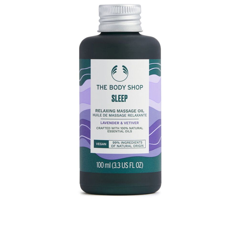 Flacone verde scuro con tappo argentato. Etichetta con testo: The Body Shop Sleep Relaxing Massage Oil. Vegano. 99% ingredienti naturali.