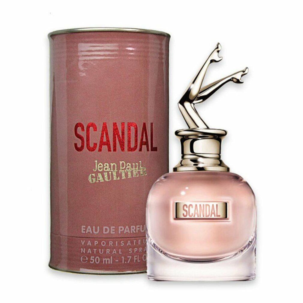 Flacone e confezione di profumo. Flacone con gambe dorate. Scritto: SCANDAL, Jean Paul Gaultier.