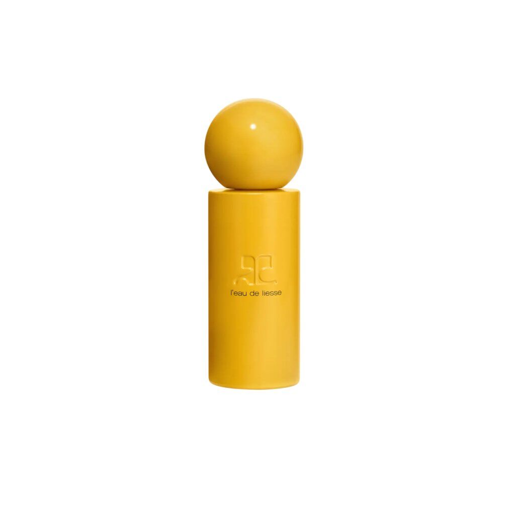 Flacone di profumo giallo con tappo sferico. Scritta: l'eau de liesse. Logo: due lettere C sovrapposte.