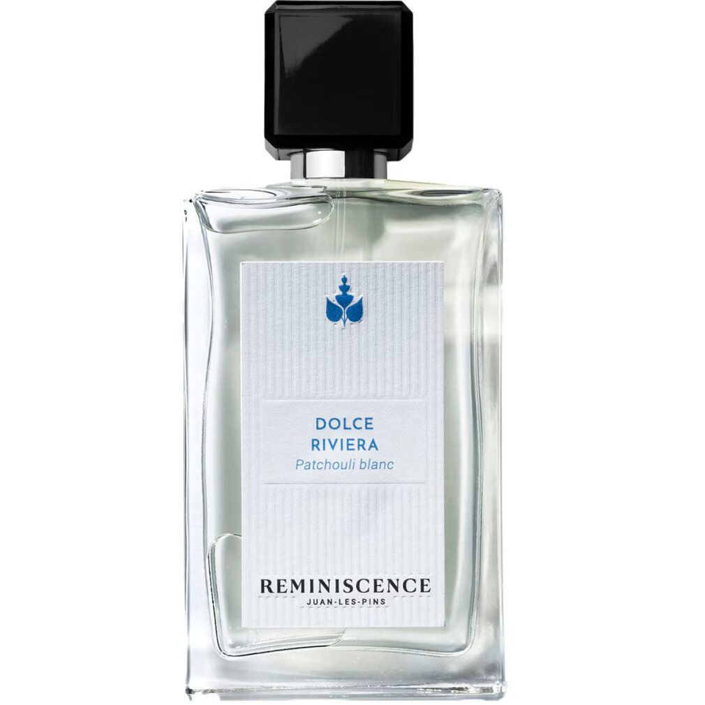 Flacone rettangolare in vetro con tappo nero. Etichetta bianca con grafica blu e testo: Dolce Riviera, Patchouli blanc, Reminiscence.