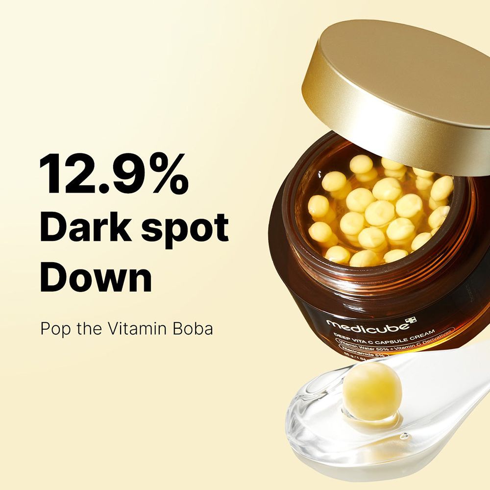 Prodotto con coperchio aperto, capsule gialle. Scritta: medicube, Deep Vita C Capsule Cream. Testo: 12.9% Dark spot Down.