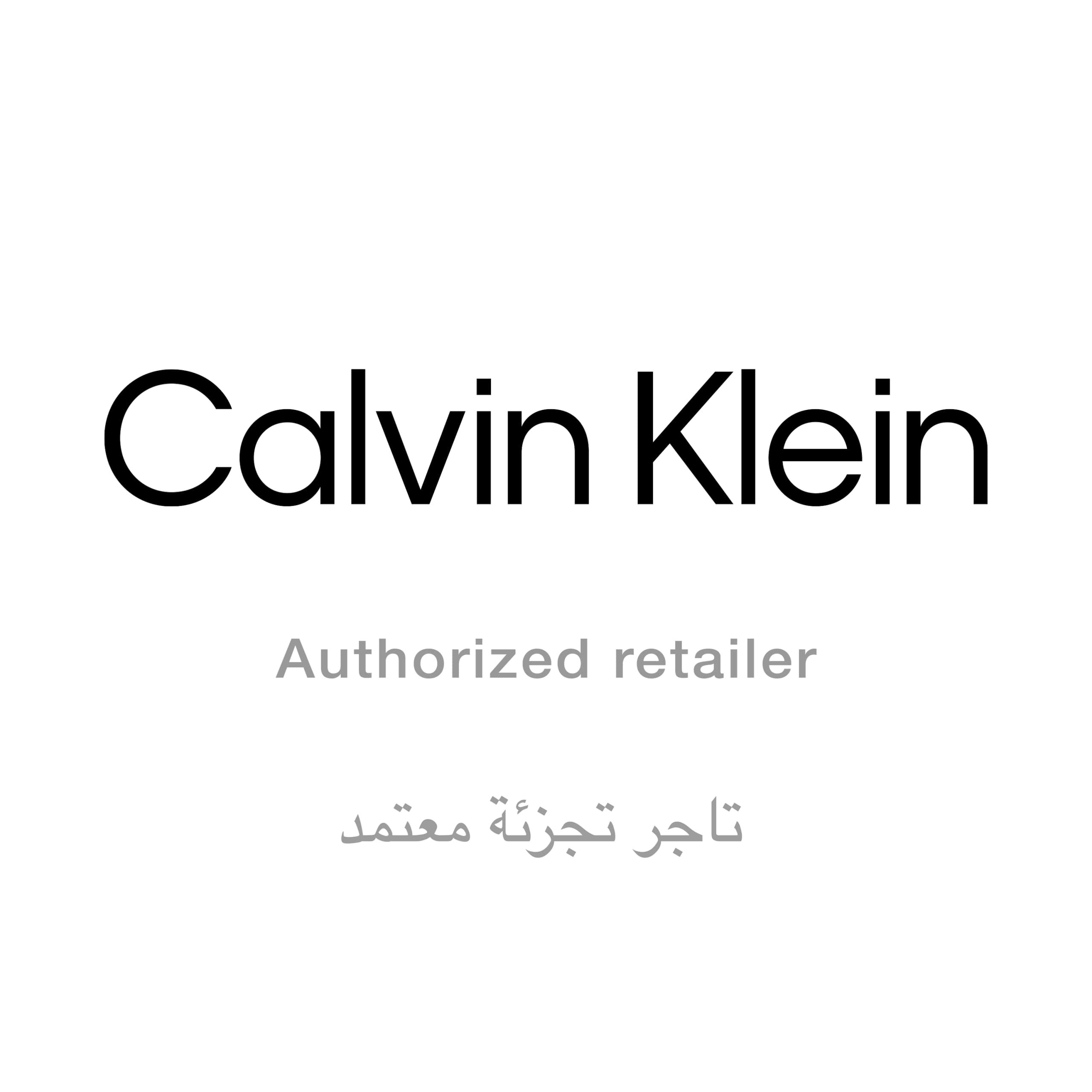 Logo Calvin Klein. Sotto, « Authorized retailer » e testo arabo.