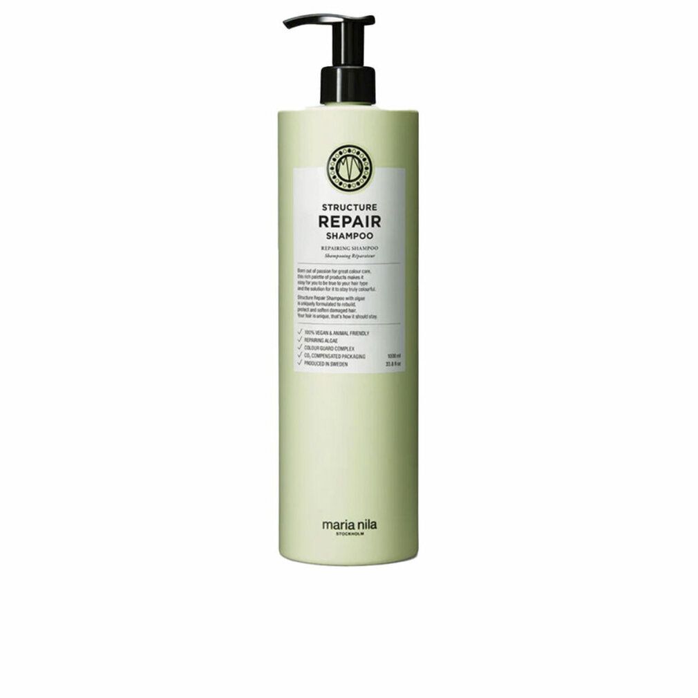Flacone verde chiaro con dispenser a pompa, etichetta con "Structure Repair Shampoo" e "Maria Nila".