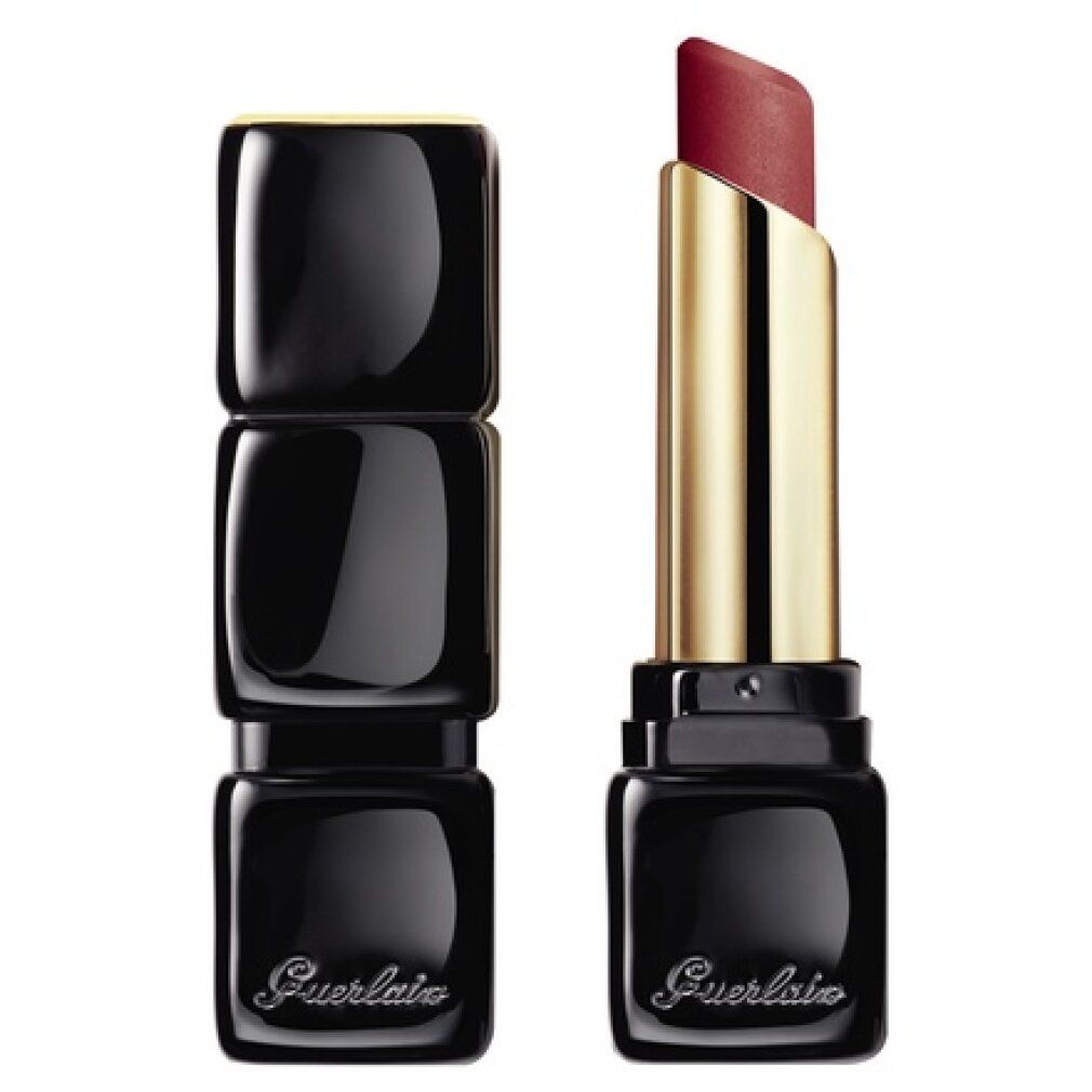 Rossetto aperto in custodia nera. Supporto dorato. Il rossetto è rosso.