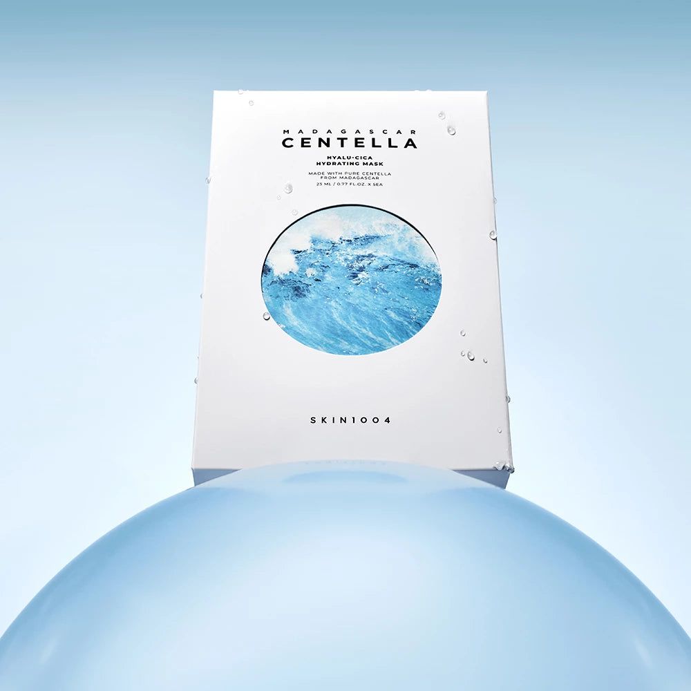 Scatola bianca di maschere viso. Scritta: Madagascar Centella. Design onde. Gocce.