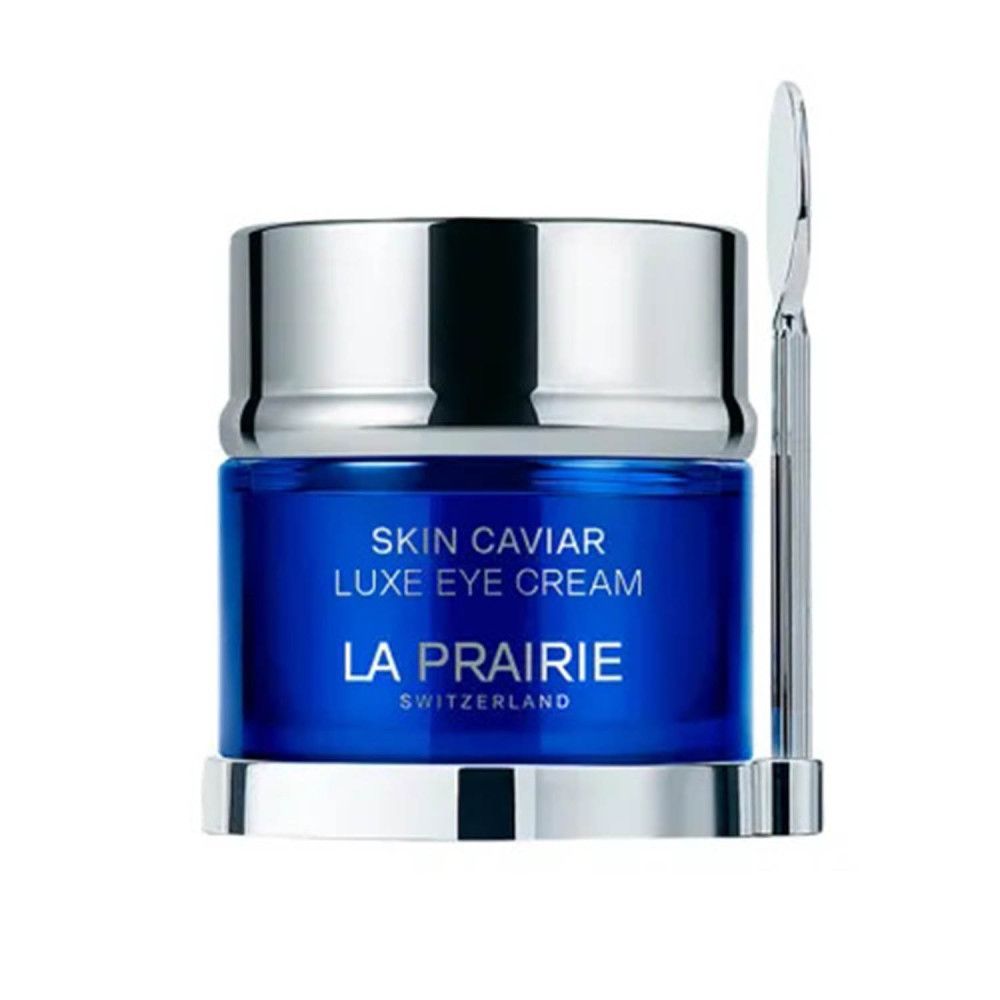 Vasetto blu con coperchio argentato e spatola. Scritta: Skin Caviar Luxe Eye Cream, La Prairie, Svizzera.