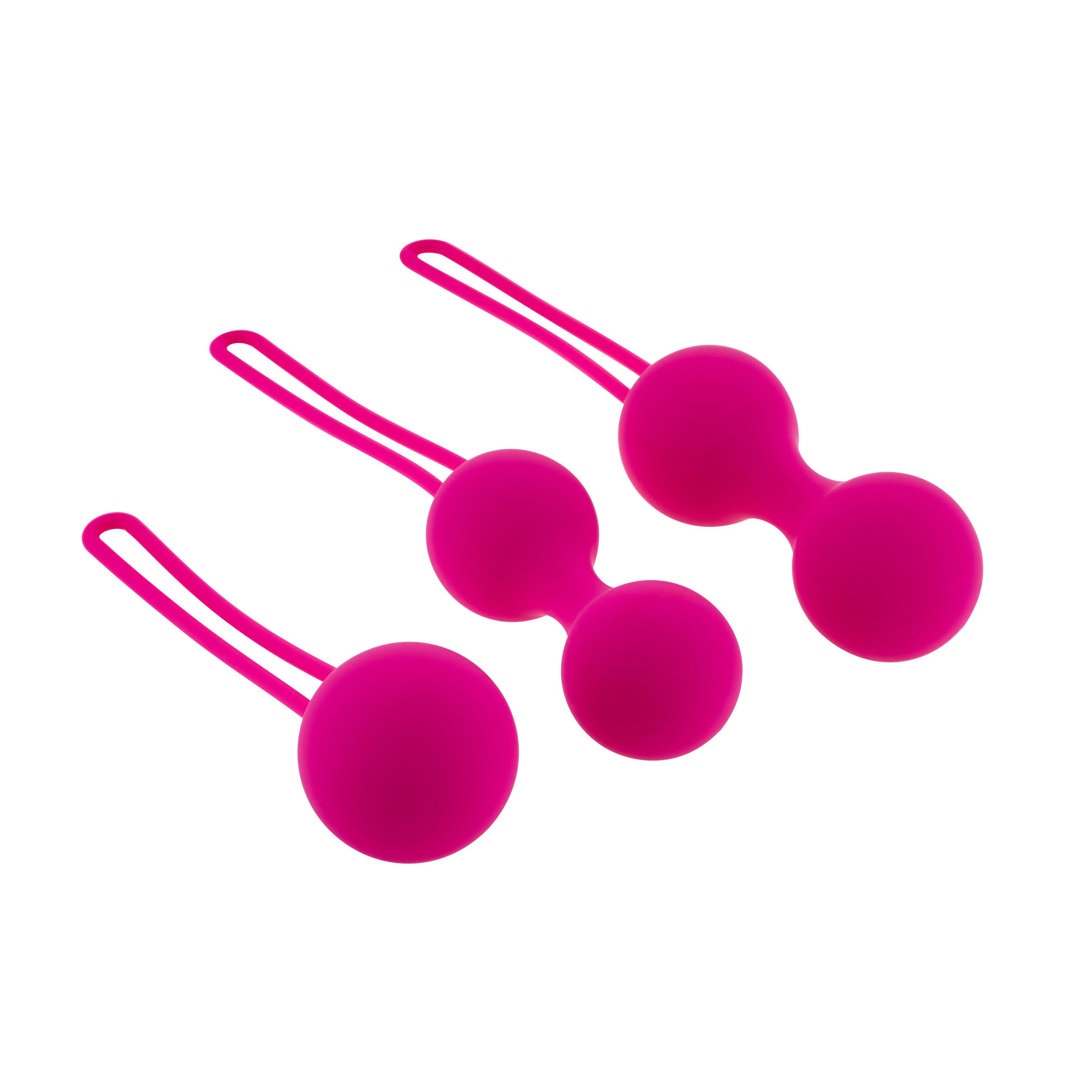 Tre sfere rosa con anelli. Diverse dimensioni.