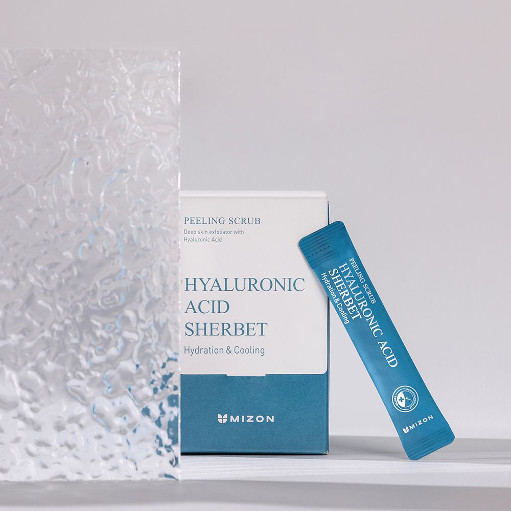 Confezione e bustina singola MIZON Hyaluronic Acid Sherbet Peeling Scrub. Confezione blu con nome del prodotto e logo.