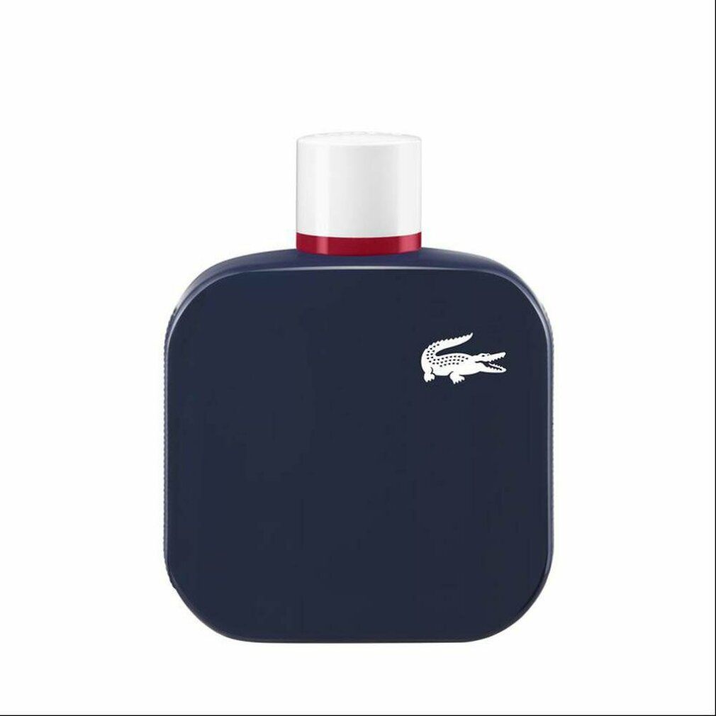 Flacone blu scuro con tappo bianco e anello rosso. Logo coccodrillo bianco. Forma quadrata con angoli arrotondati.
